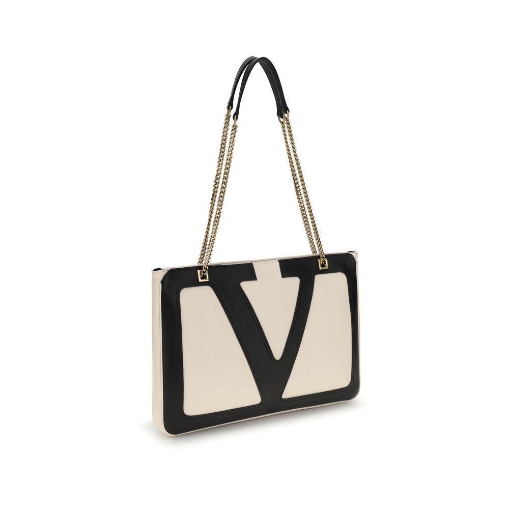 Front view with bag zipped and handles upright.